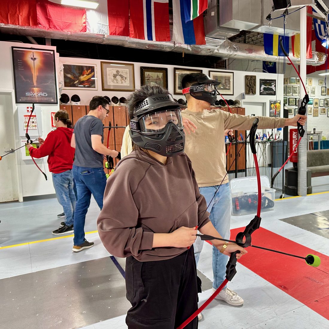 Adults playing Archery Tag at Nova during a group event